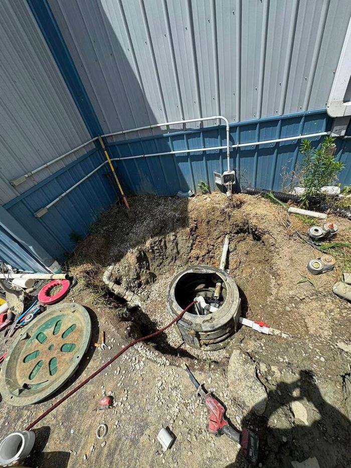 Sewer line excavation and repair in a yard